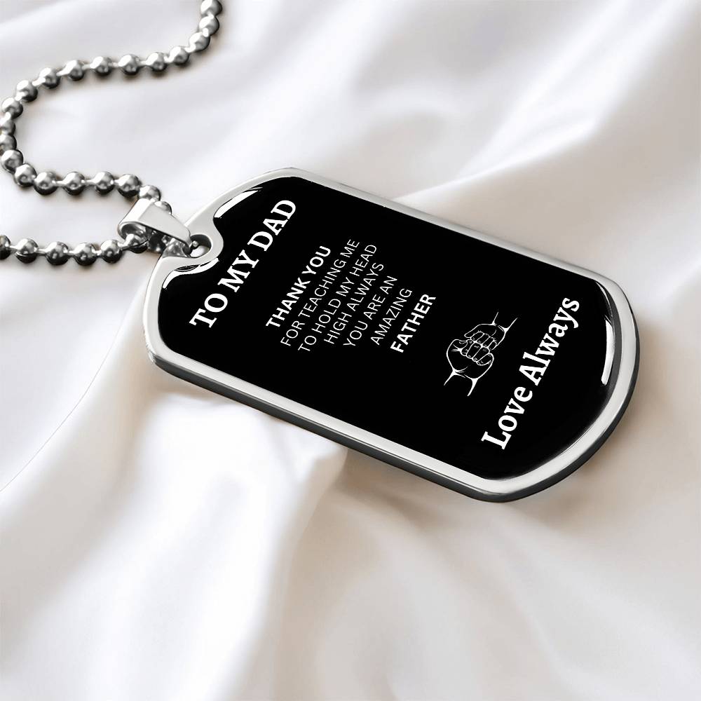 Front view of silver dog tag with 'To My Dad' engraving, made from high-quality surgical steel, showcasing a sleek and polished design."