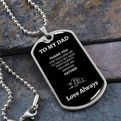 Front view of silver dog tag with 'To My Dad' engraving, made from high-quality surgical steel, showcasing a sleek and polished design."