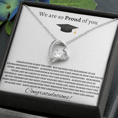 Silver heart-shaped necklace displayed with a message card, featuring a sparkling cubic zirconia crystal and a sleek design for a heartfelt gift.